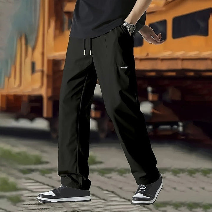 Pantalon homme coupe droite décontractée vert kaki, style moderne et confortable, essentiel pour l'été.
