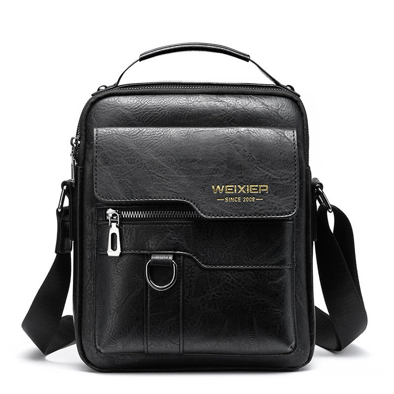 Sac bandoulière vertical homme en cuir synthétique marron, élégant pour travail et messager.