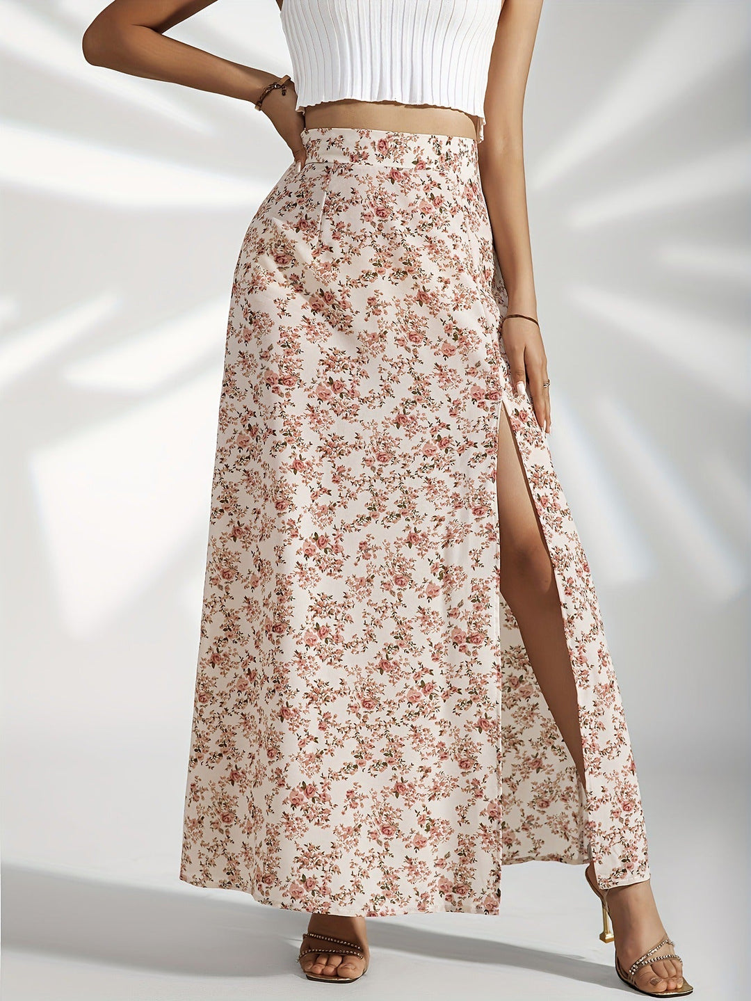 Jupe fluide longue femme à imprimé floral, style élégant et décontracté. Parfaite pour l'été, avec fente latérale.