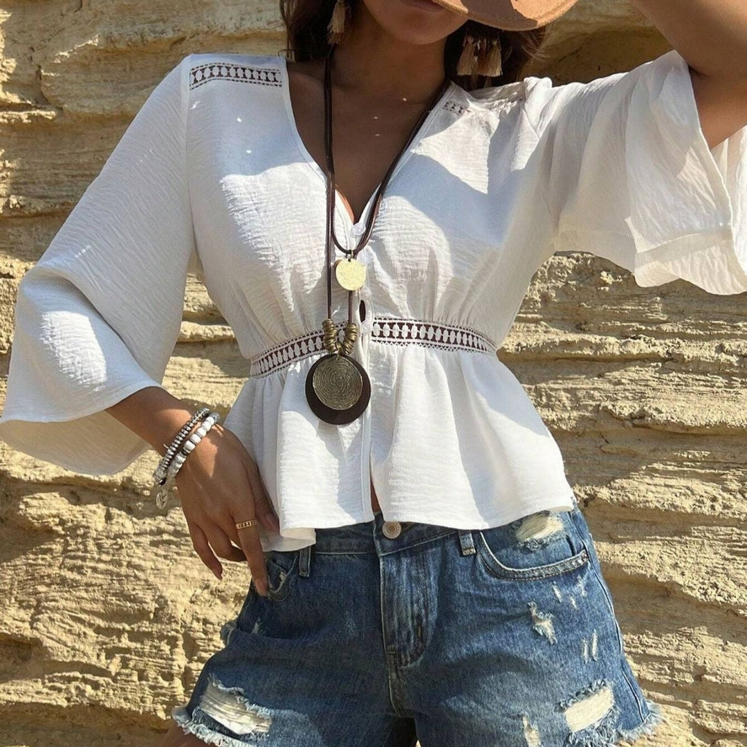 Haut femme élégant bohème fluide, col en V et manches larges. Parfait pour une tenue légère d'été.