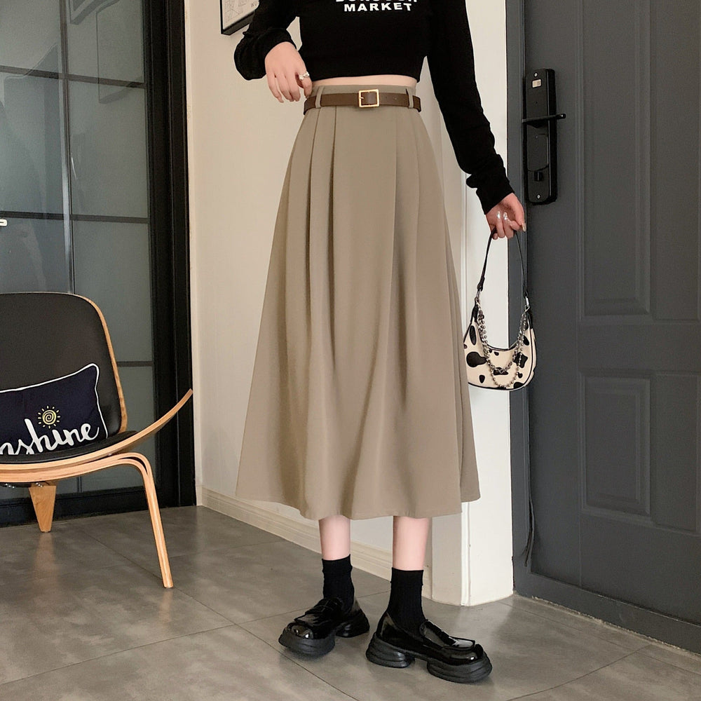 Jupe midi femme évasée fluide, idéale pour la tenue de bureau ou un look décontracté chic.