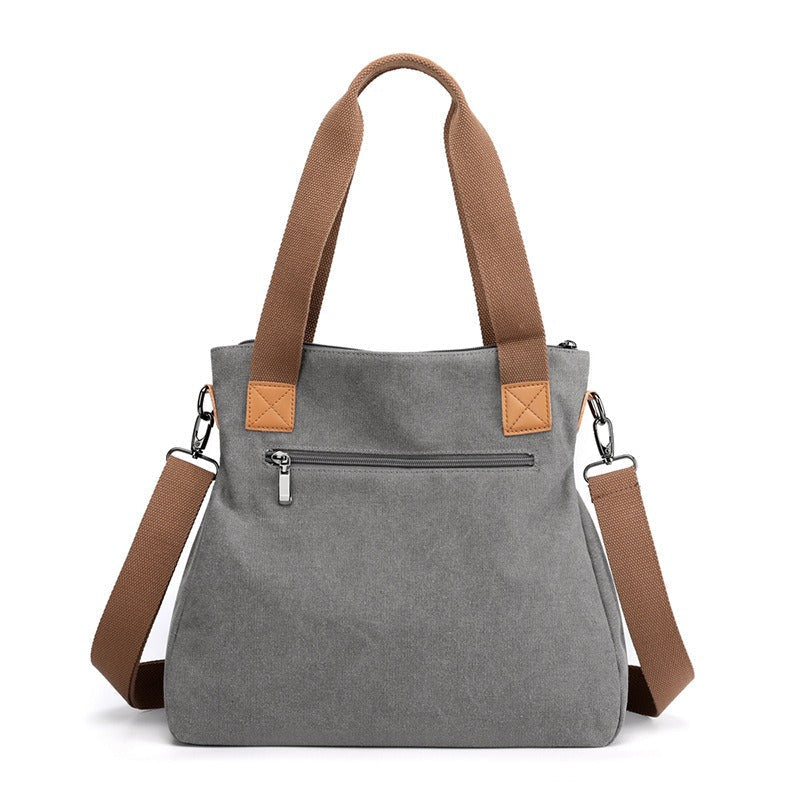 Grand sac à main fourre-tout polyvalent pour femme en toile résistante, idéal pour voyage ou usage quotidien.