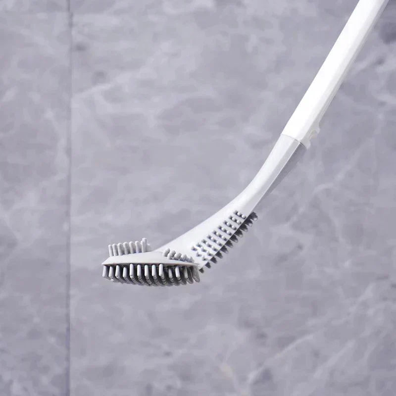 Brosse de nettoyage WC en TPR souple et hygiénique, avec support mural discret pour la salle de bain.