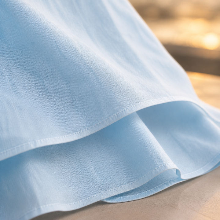 Robe femme midi fluide, détails élégants, idéale pour cérémonie, mariage ou tenue de soirée chic.