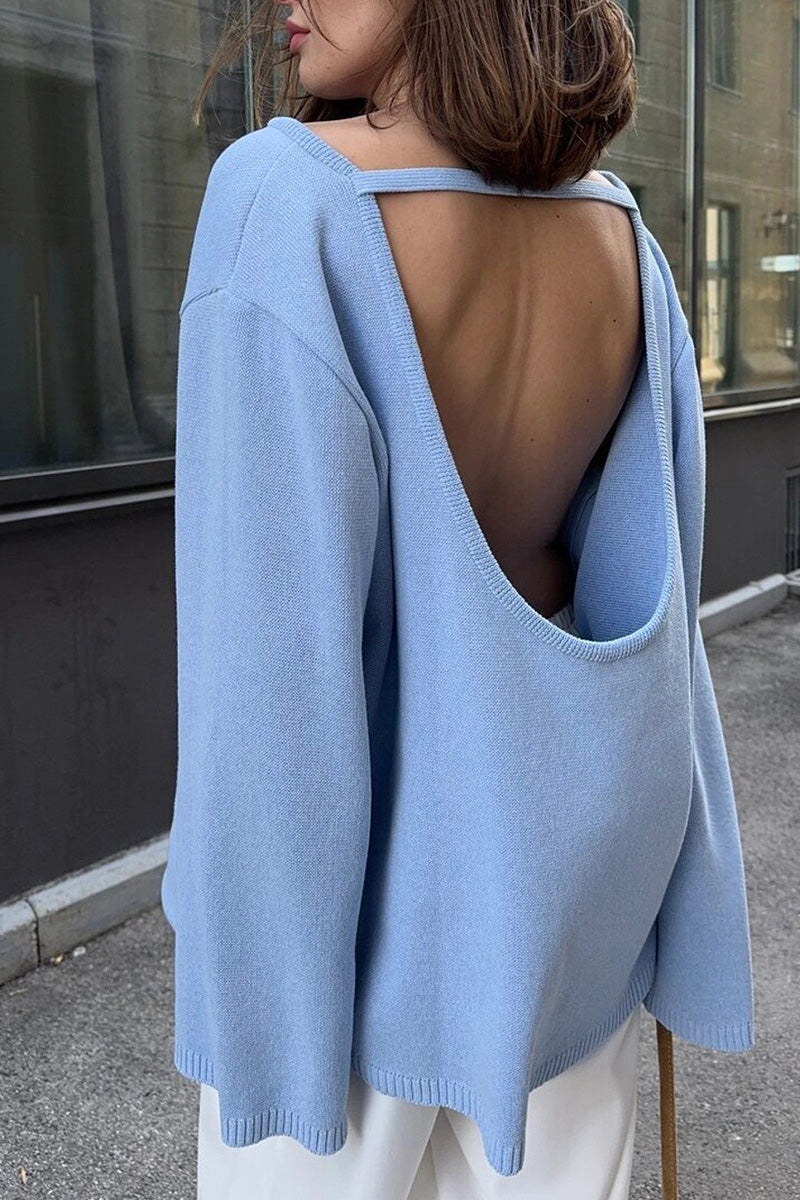 Vue de face d'un pull femme oversize noir, manches longues, silhouette décontractée chic et tendance.