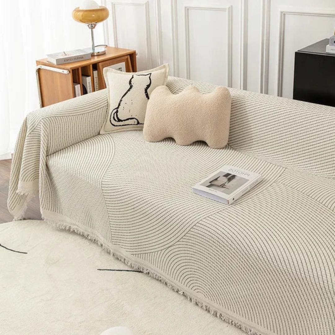 Jeté de canapé en textile doux, design scandinave avec franges, pour un salon confortable et une décoration tendance.