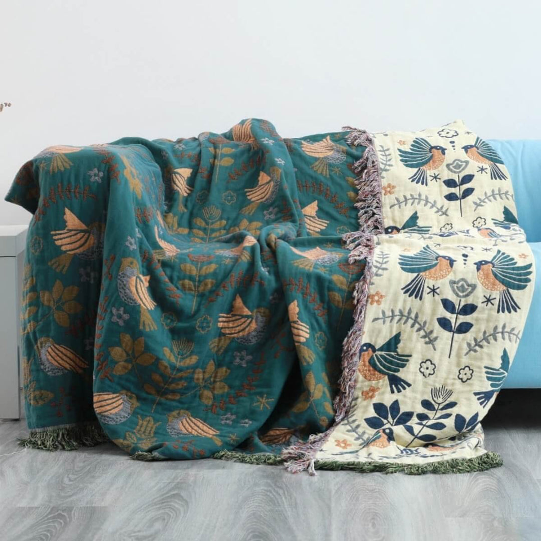 Jeté de canapé scandinave réversible en coton, motif oiseaux. Parfait pour une décoration confortable et moderne.