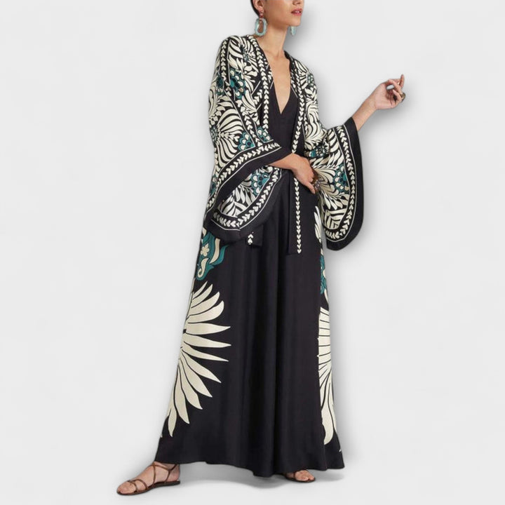 Robe longue fleurie fluide et élégante pour femme, idéale printemps/été, style chic décontracté avec col montant.