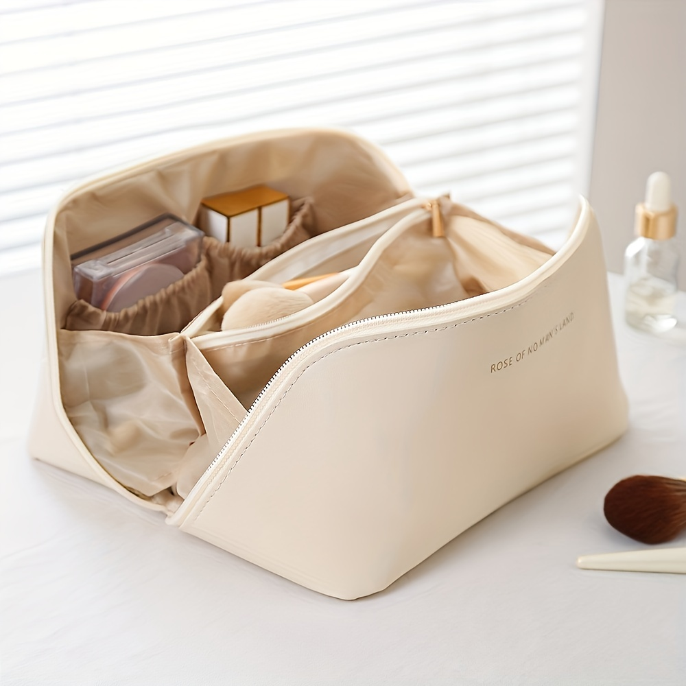 Organisateur de maquillage de voyage rose, portable et élégant pour femmes, avec fermeture éclair.