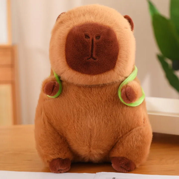 Doudou animal capybara marron avec son ami tortue sur le dos. Jouet doux et parfait pour des câlins d'enfant.