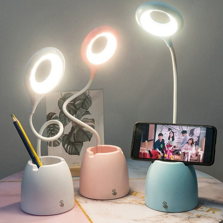 Lampe LED enfant rose avec support téléphone et rangement pour bureau ou chevet. Lumière ajustable.