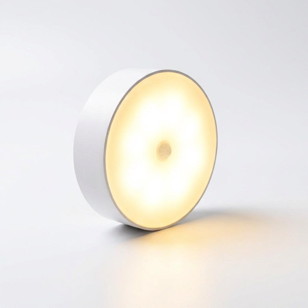 Éclairage intérieur LED sans fil rechargeable, rond, avec détecteur de mouvement pour installation facile.