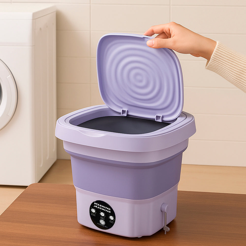 Lave-linge compact pliable vert pour petits espaces, solution pratique et éco-énergétique pour votre lessive.