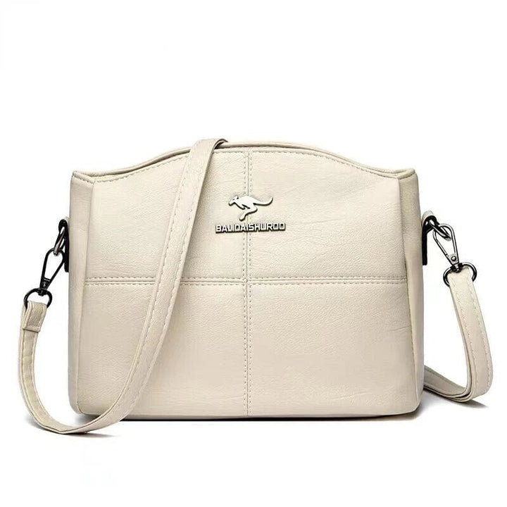 Sac de mode femme en cuir, bandoulière amovible, parfait pour un style adaptable et chic.
