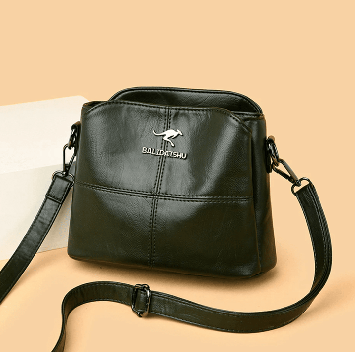 Sac bandoulière femme en cuir beige, un accessoire mode chic et confortable au quotidien.