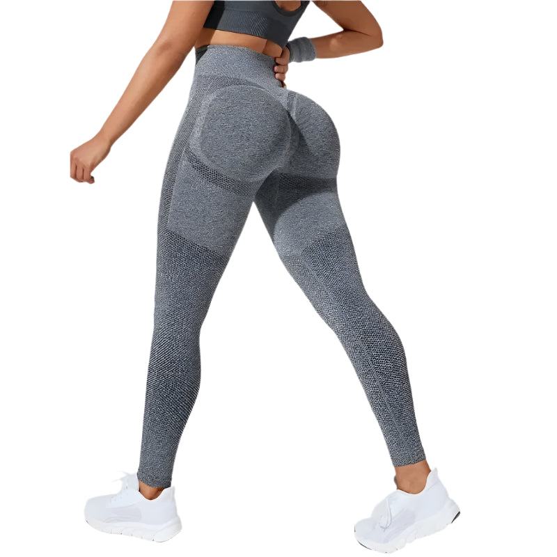 Legging sport femme sans coutures, confortable pour yoga, course et musculation, offre maintien.