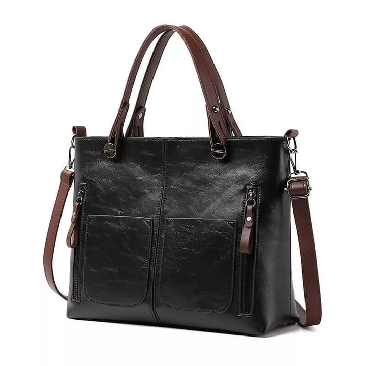 Sac bandoulière femme en cuir noir, élégant et durable. Bretelle ajustable pour un port confortable.