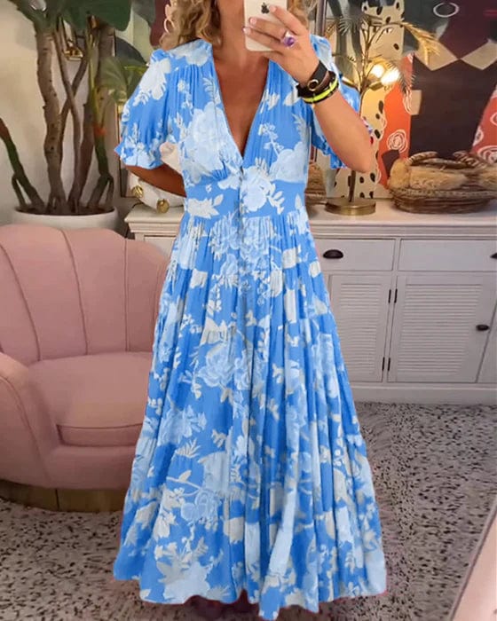 Confortable robe longue Izara femme à col en V, en tissu léger. Parfaite pour la mode estivale et un style fluide.