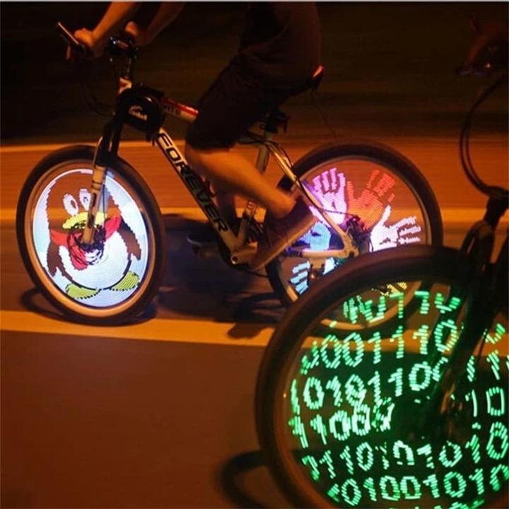 Effet 3D dynamique des lumières LED sur roue de vélo en mouvement, garantissant une sécurité accrue la nuit.