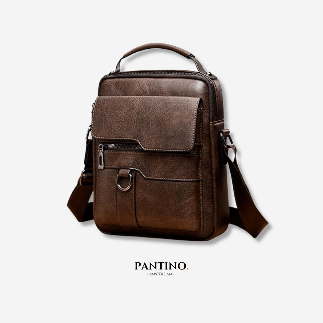 Sac à bandoulière moderne porté, alliant confort et élégance. Accessoire unisexe chic pour un look contemporain.