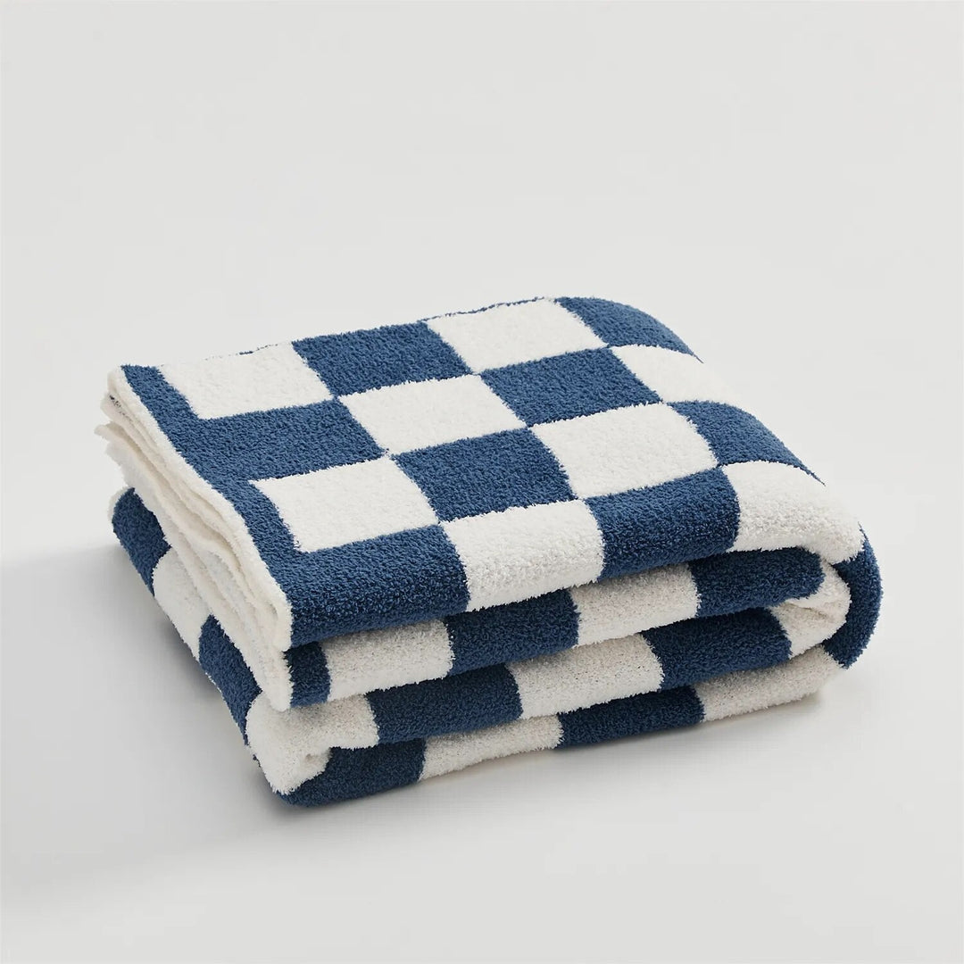 Plaid doux et confortable avec motifs à carreaux. Idéal pour un cadeau ou la maison.