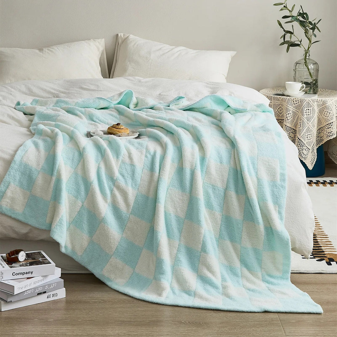Couverture à carreaux, douceur incomparable pour les moments de confort et de style à la maison.