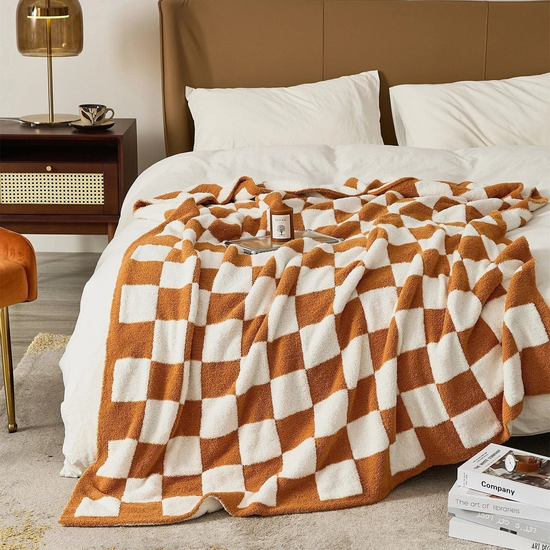 Couverture douce et confortable à carreaux pour des soirées au chaud, style et élégance.