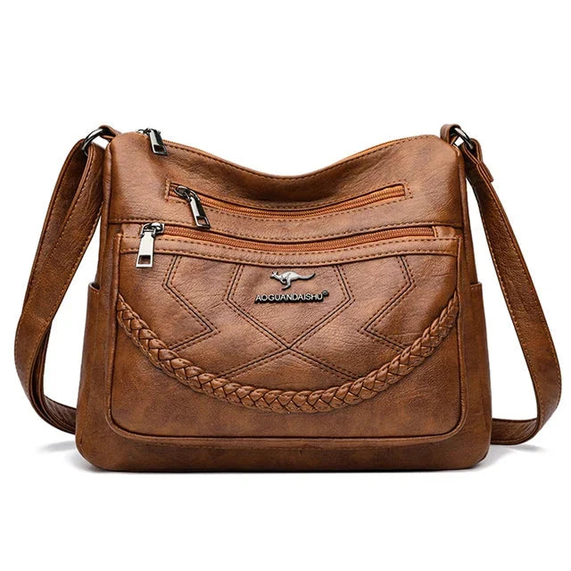 Sac bandoulière élégant et confortable en cuir souple pour femme, luxe et mode, accessoire chic au quotidien.