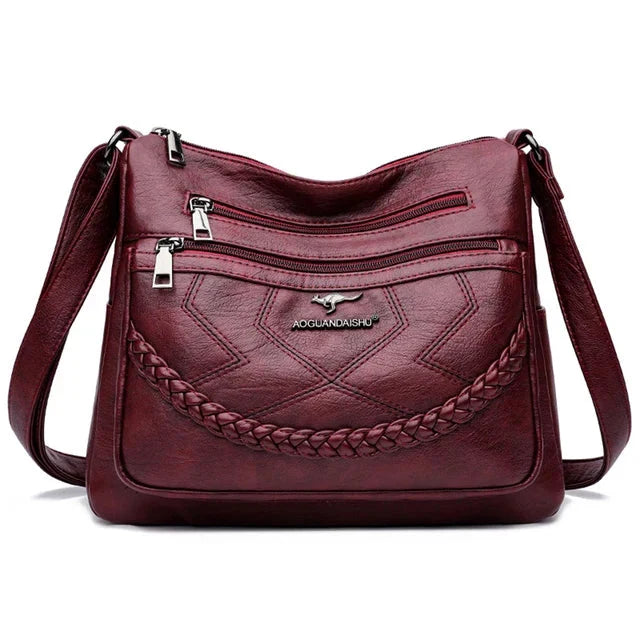 Sac bandoulière élégant et polyvalent en cuir souple pour femme, accessoire mode luxe chic et confortable.