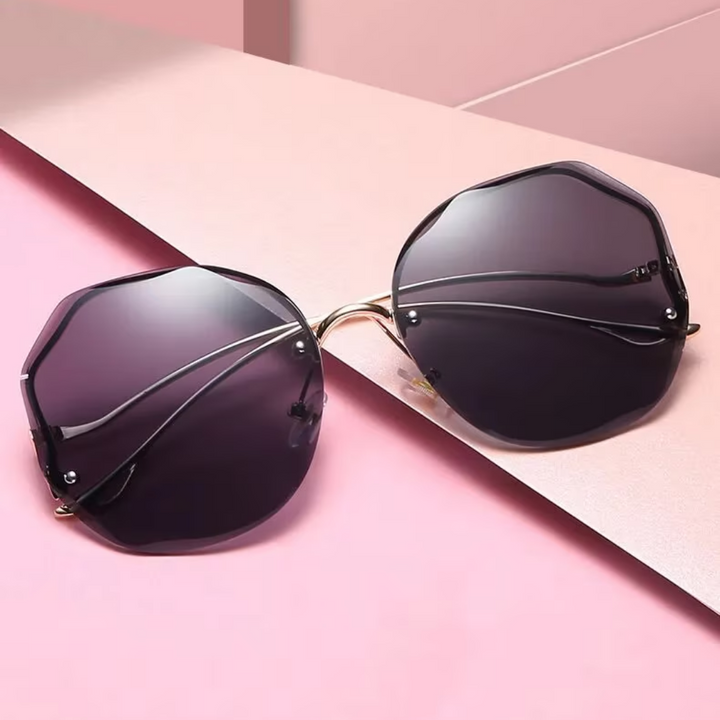 Lunettes de soleil estivales dégradées, luxe unisexe, protection UV essentielle, accessoire chic sans monture.
