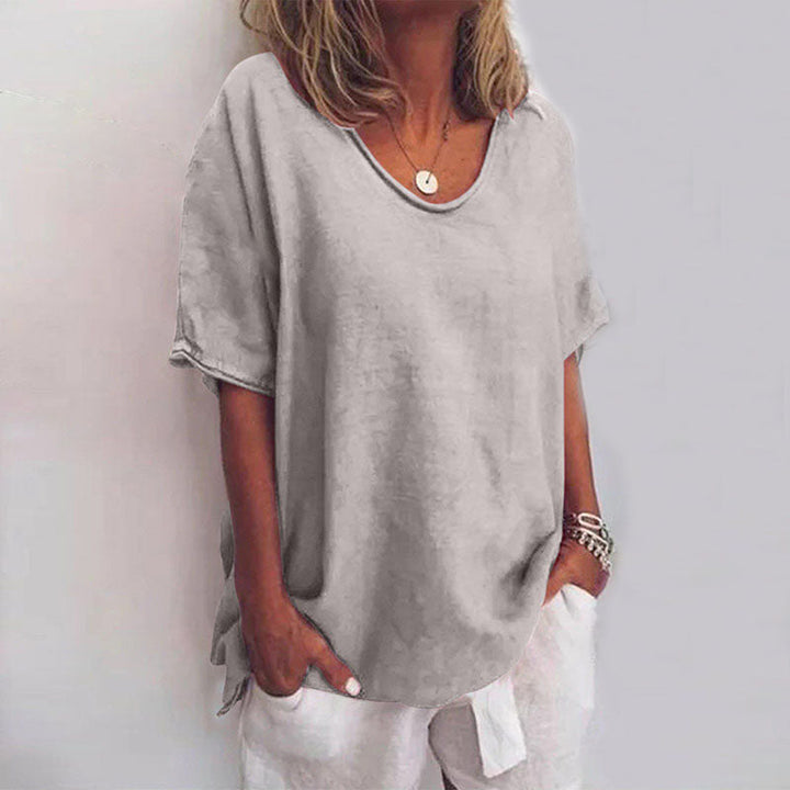 Blouse femme classique ample à manches courtes, parfaite pour un look chic et décontracté au printemps/été.