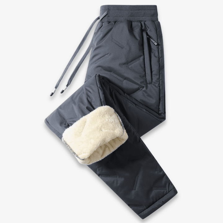 Bas thermique femme noir, coupe droite, offrant chaleur et style pour les activités hivernales ou le quotidien.