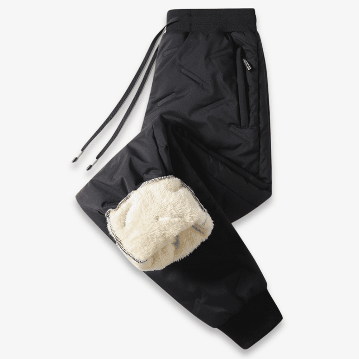 Pantalon thermique doublé noir pour femme, coupe élégante, idéal pour l'hiver et le quotidien.