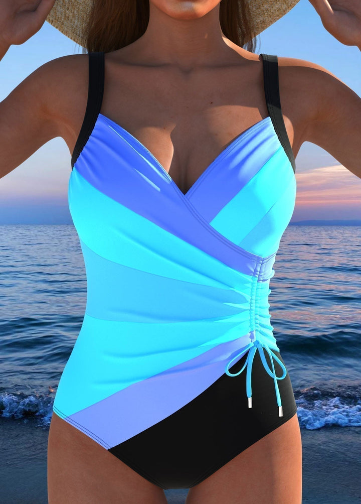 Maillot de bain une pièce femme confortable pour l'été, avec imprimé tendance et décolleté croisé. Idéal vacances.