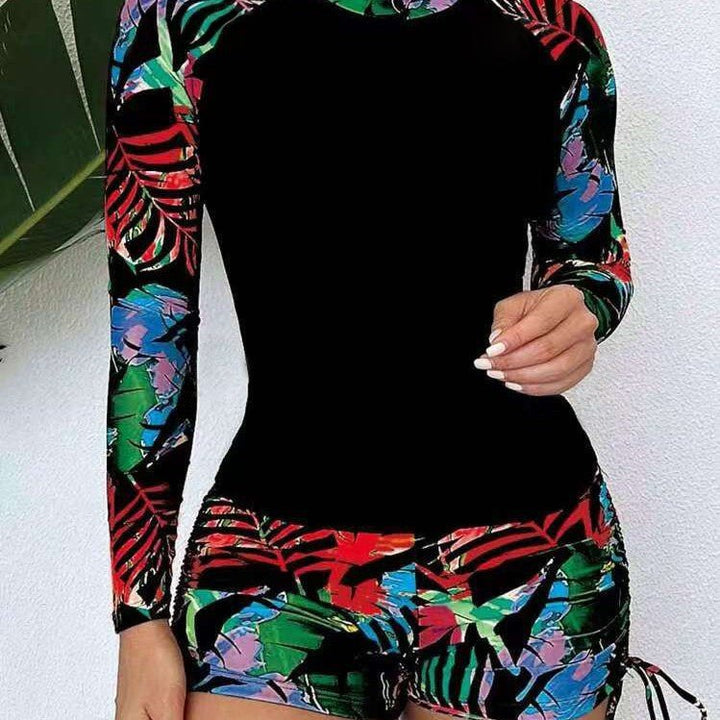 Maillot de bain femme élégant, une pièce, manches longues, motif marin, idéal plage et piscine.