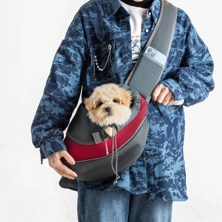 Sac de transport bandoulière confortable pour petit chien ou chat, idéal pour promenades et voyages sécurisés.
