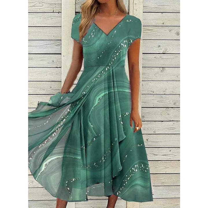 Élégante robe midi imprimée fluide pour femme, col V, offrant confort et style pour toutes saisons.