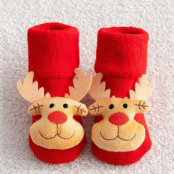 Détail des ornements interactifs sur le sapin de Noël Montessori en feutre. Jouet lumineux pour enfant.