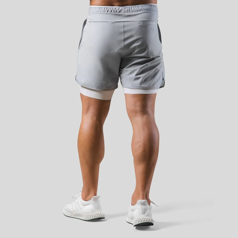 Pantalon de jogging homme 2-en-1 avec short intégré. Pour performance en sport.
