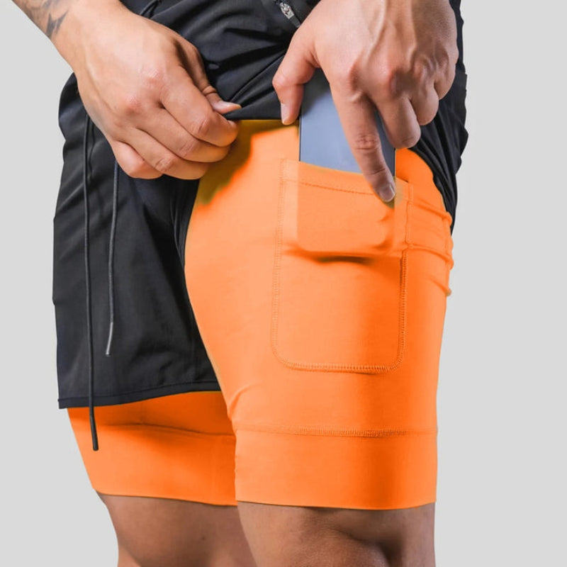 Pantalon de sport homme 2-en-1, technologie de compression. Idéal running.