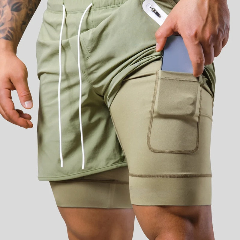 Pantalon de compression homme 2-en-1 idéal entraînement gym. Performance et style athlétique.