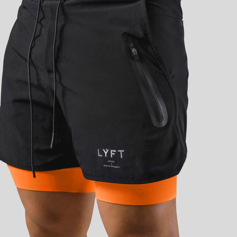 Pantalon homme 2-en-1 pour fitness et athlétisme. Respirant, avec poches.