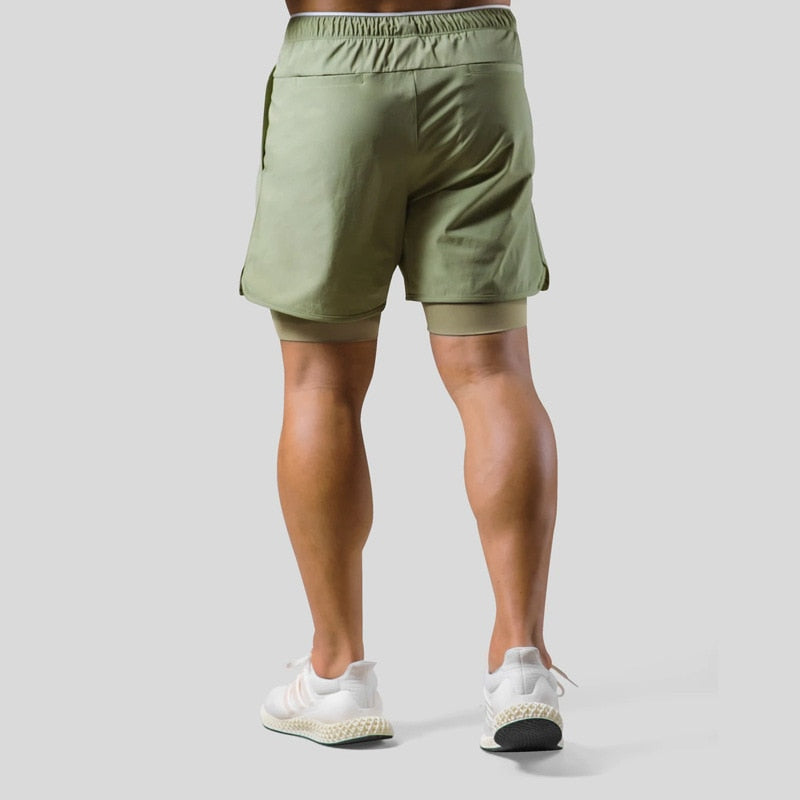 Pantalon sport homme 2-en-1, coupe athlétique. Optimise le running et fitness.