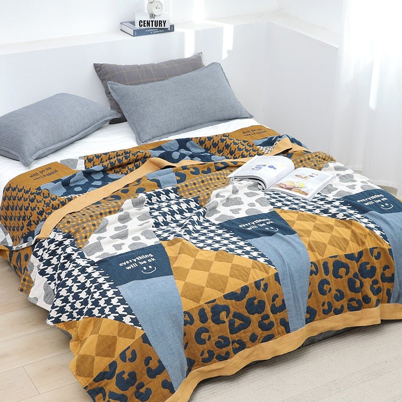 Jeté de canapé en coton bohème, motifs scandinaves élégants, crée une atmosphère cosy et accueillante.