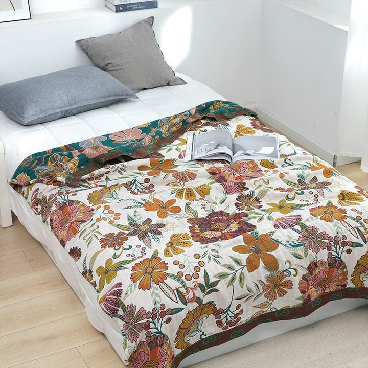 Plaid en coton confortable, design scandinave et bohème, idéal pour les soirées cocooning sur le canapé.