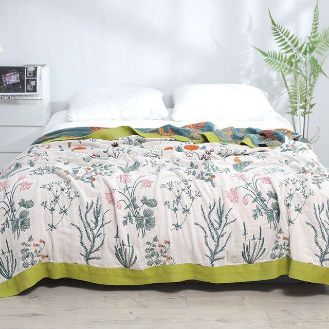 Design bohème scandinave pour cette couverture en coton, idéale comme plaid de canapé décoratif.
