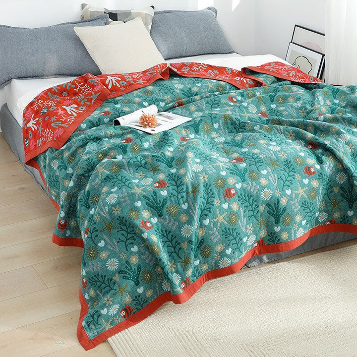 Confortable couverture en coton, style bohème chic scandinave, pour une décoration d'intérieur unique.