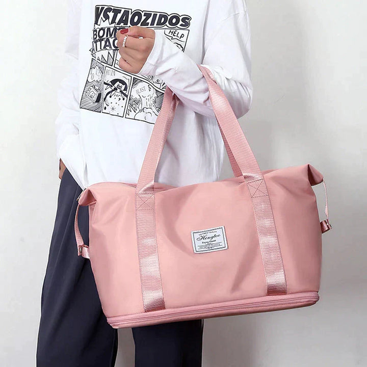 Sac de voyage pliable imperméable pour femmes, idéal week-end et sport. Léger et pratique.