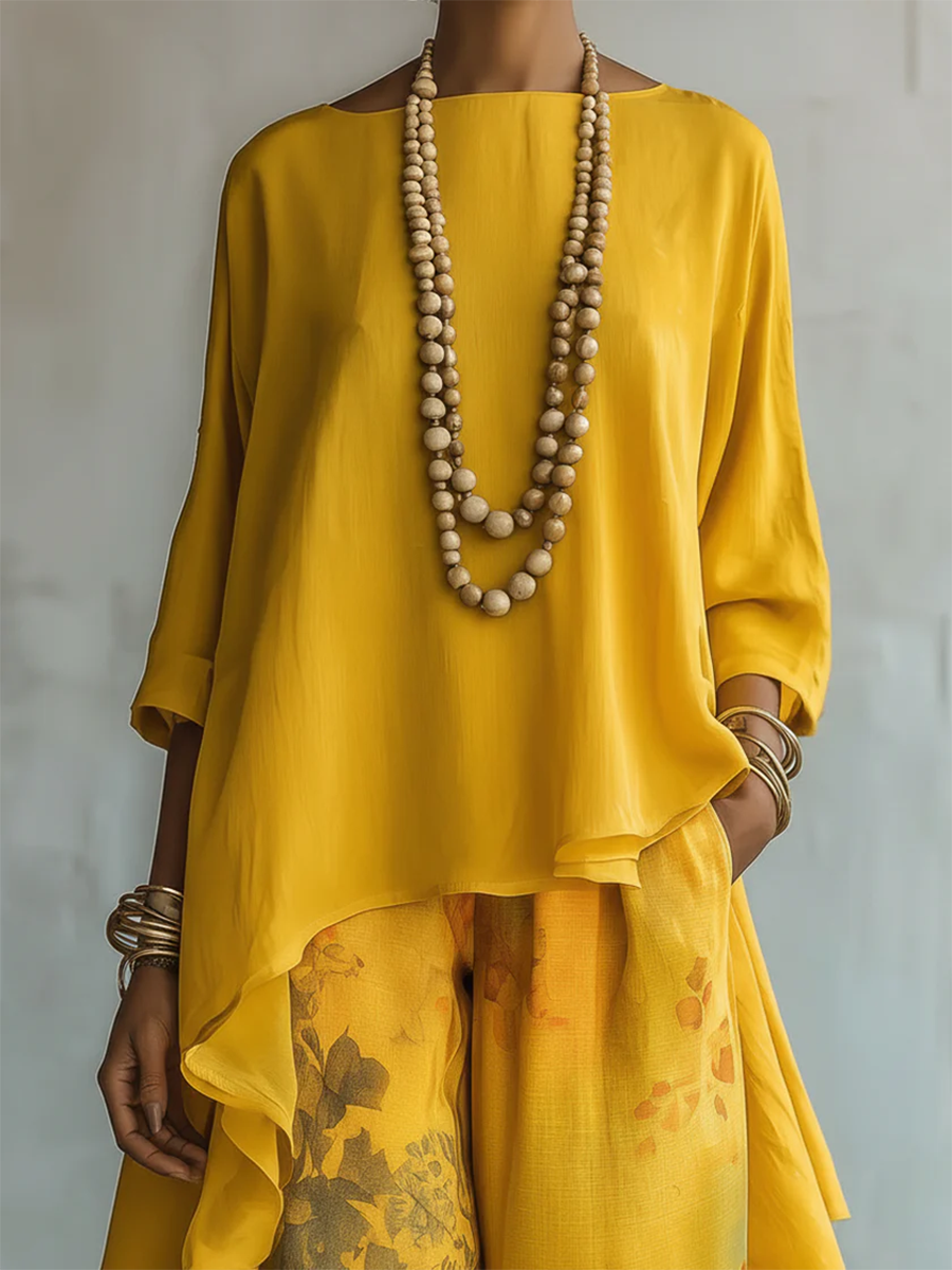 Ensemble femme fluide bohème pour un confort élégant : haut asymétrique et pantalon floral, idéal pour les chaudes journées.