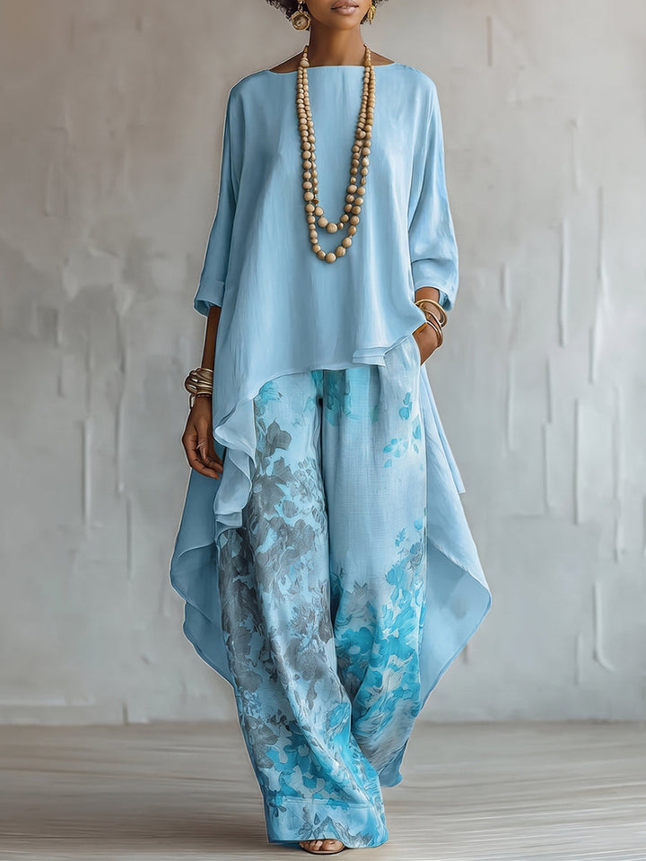 Vêtements d'été femme : ensemble fluide bohème chic, haut asymétrique et pantalon floral pour un look élégant et léger.